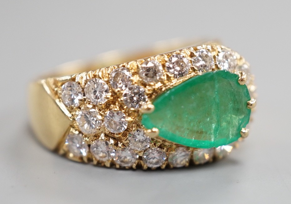 A modern yellow metal, pear cut emerald and diamond cluster set dress ring, size H, gross weight 5.1 grams.
